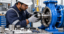 Professional industrial photo of a technician carefully installing a mechanical seal